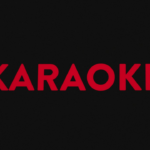 A red karaoke logo on a black background — Foto por Samuel Regan-Asante na Unsplash